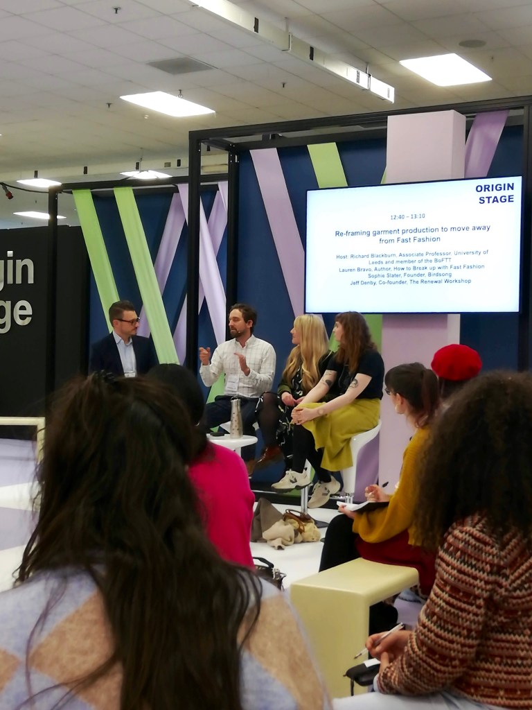 4 people hosting a debate with other people looking on from the audience at Pure London fashion trade show